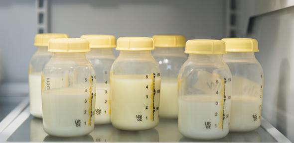 Breast milk in bottles (credit: Jamie Grill/The Image Bank)