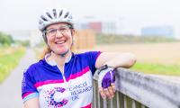 Dr Helen Mott getting on her bike to promote Cancer Research UK’s Cycle 300 fundraising initiative.